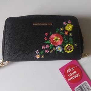 Brand new wallet that you can put your phone in...never used